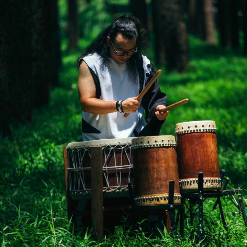 A man playing Thai Drums and Percussion